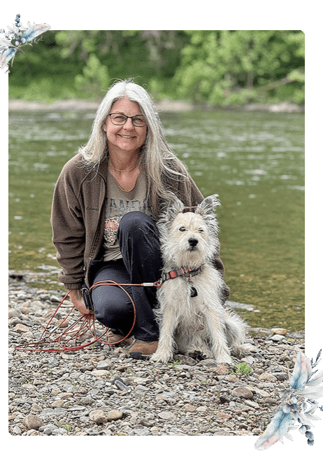 Lisa Columbo, licensed clinical social worker or LCSW, posing by river with her dog, Wiley