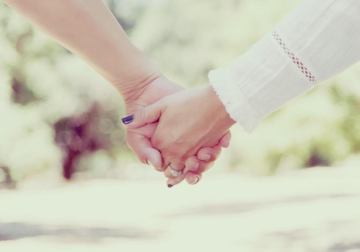 a couple holding hands